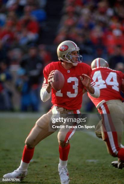 Steve Bono of the San Francisco 49ers drops back to pass against the Kansa City Chiefs during an NFL football game December 14, 1991 at Candlestick...