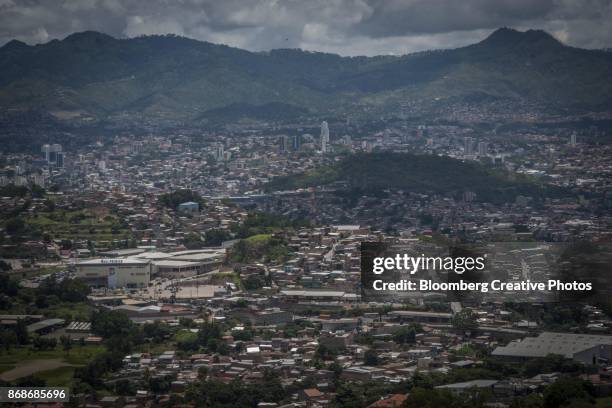 residential and commercial buildings stand in tegucigalpa, honduras - honduras stock pictures, royalty-free photos & images