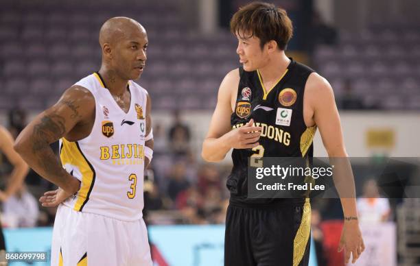 Stephon Marbury of Beijing Beikong Fly Dragons and Ding Yanyuhang of ShanDong Hi-Speed look up during the game against the 2017/2018 CBA League match...