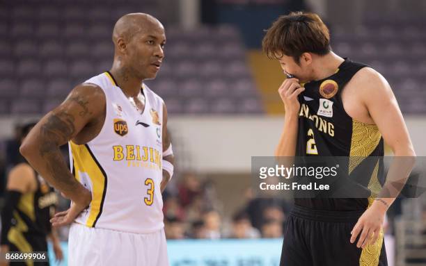 Stephon Marbury of Beijing Beikong Fly Dragons and Ding Yanyuhang of ShanDong Hi-Speed look up during the game against the 2017/2018 CBA League match...