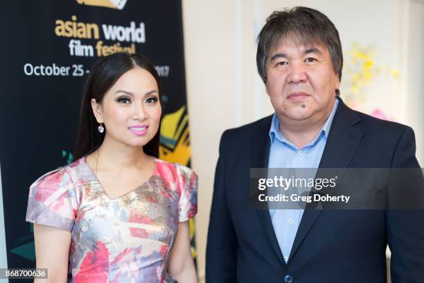 Actress, Singer, Philanthropist Ha Phuong Cha Tran and AWFF Founder & Chairman Sadyk Sher-Niyaz attend a reception as Angelina Jolie Accepts the...