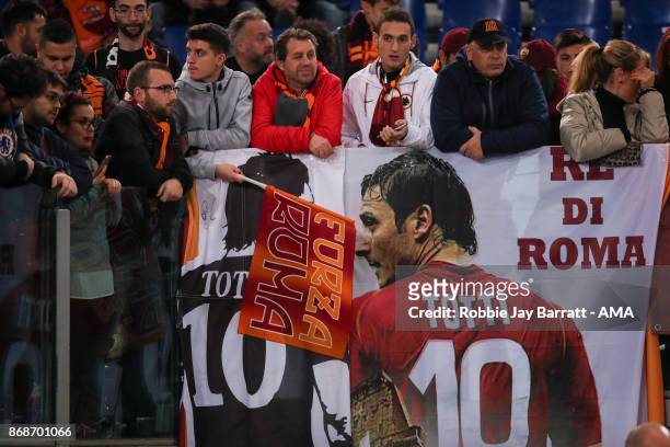 Fans of AS Roma stand behind banners of Francesco Totti during the UEFA Champions League group C match between AS Roma and Chelsea FC at Stadio...