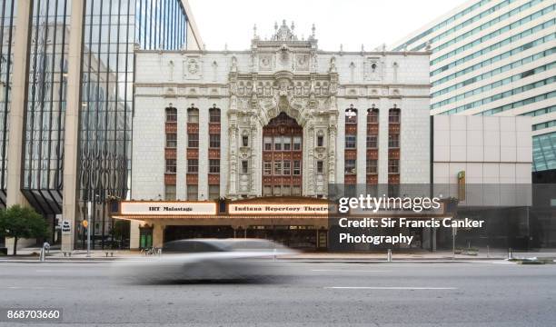 white car at full speed past the main facade of 'indiana repertory theatre' (irt) in indianapolis, usa - careen opera stock pictures, royalty-free photos & images