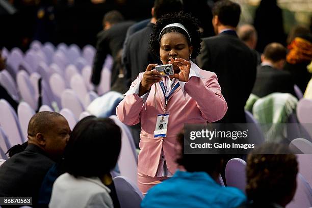 One of Jacob Zuma's daughters takes a photo of her siblings at the inauguration ceremony of Jacob Zuma on May 9, 2009 in Pretoria, South Africa....