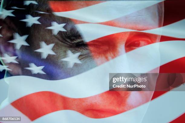 An American flag is seen with a portrait of Russian president Vladimir Putin in this photo illustration on October 31, 2017. Material posted on...