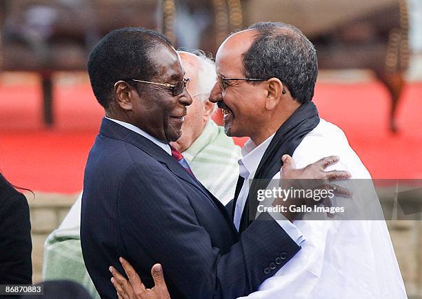 President of Zimbabwe Robert Mugabe greets a dignitary at the inauguration ceremony of Jacob Zuma on May 9, 2009 in Pretoria, South Africa. Jacob...