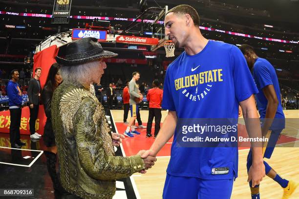 Klay Thompson of the Golden State Warriors shakes hands with Superfan, James Goldstein before the game on October 30, 2017 at STAPLES Center in Los...