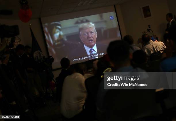 Children from 22 countries watch a video featuring U.S. President Donald Trump congratulating them on their U.S. Citizenship after the childen took...