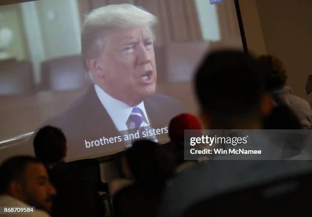 Children from 22 countries watch a video featuring U.S. President Donald Trump congratulating them on their U.S. Citizenship after the childen took...