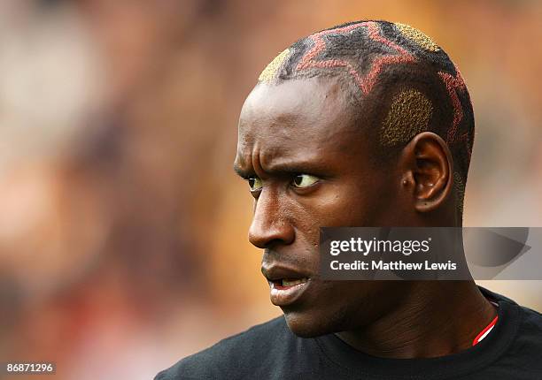 Ibrahima Sonko of Stoke City sports a new haircut during the Barclays Premier League match between Hull City and Stoke City at the KC Stadium on May...