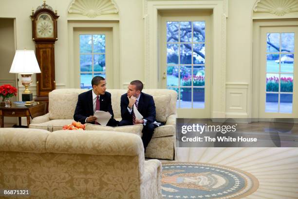 In this handout provide by the White House, U.S. President Barack Obama meets with the Director of Speechwriting Jon Favreau in the Oval Office of...