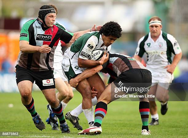 Mike Ross and Nick Easter of Harlequins tackle Chris Hala'Ufia of London Irish during the Guinness Premiership Semi Final match between Harlequins...