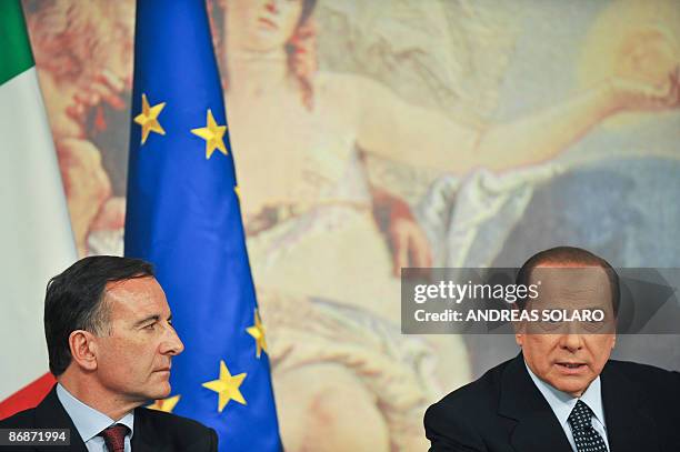 Italy's Prime Minister Silvio Berlusconi gives a joint press conference with foreign minister Franco Frattini on May 9, 2009 at Palazzo Chigi, the...