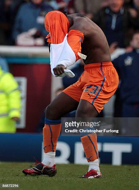 Andre Bikey of Reading rips off his shirt after being given a red card during the Coca-Cola Championship Play-off Semi Final First Leg match between...