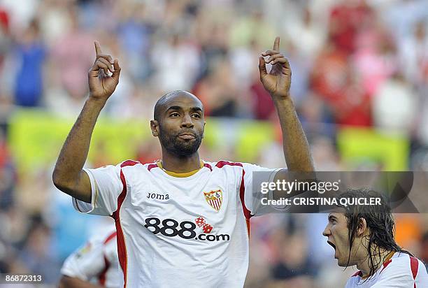 Sevilla's French born Malian Frédéric Kanouté celebrates with Spanish teammate Diego Capel after scoring against Mallorca during their Spanish league...