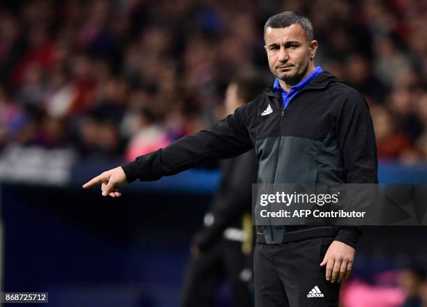 Qarabag's Azerbaijani coach Gurban Gurbanov gestures during the UEFA Champions League football match Club Atletico de Madrid vs Qarabag FK at the...