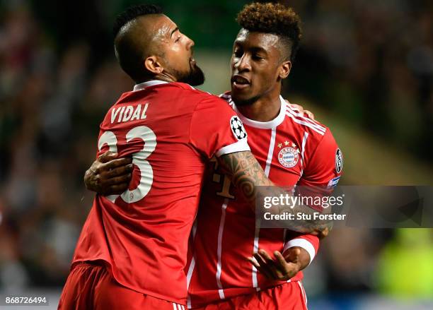 Kingsley Coman of Bayern Muenchen celebrates scoring his side's first goal with Arturo Vidal of Bayern Muenchen during the UEFA Champions League...