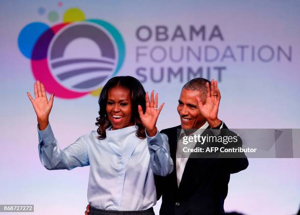 Former US President Barack Obama and his wife Michelle arrive at the Obama Foundation Summit in Chicago, Illinois, October 31, 2017. / AFP PHOTO /...