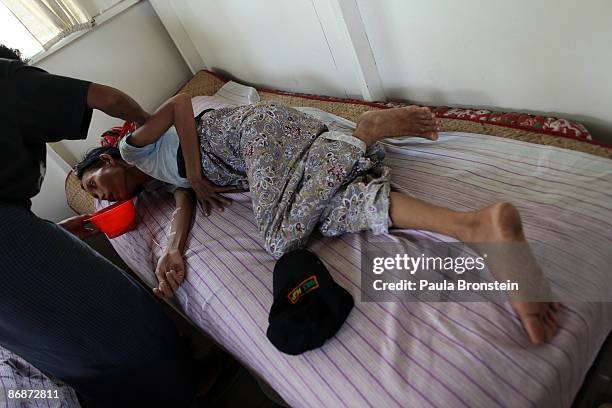 Ma Khin Lay suffering from severe pains after not being treated properly at the general hospital and later transferred to an AIDS hospital with low...