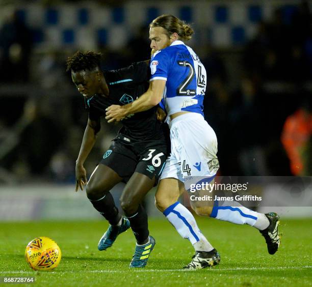 Domingos Quina of West Ham United battles with Stuart Sinclair of Bristol Rovers during the Checkatrade Trophy match between Bristol Rovers and West...