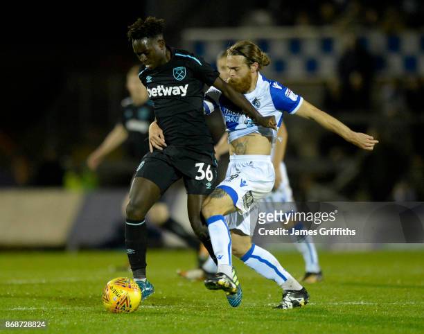 Domingos Quina of West Ham United battles with Stuart Sinclair of Bristol Rovers during the Checkatrade Trophy match between Bristol Rovers and West...
