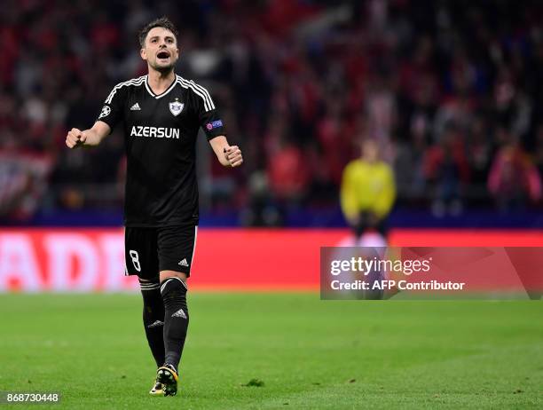 Qarabag's Spanish midfielder Michel celebrates a goal during the UEFA Champions League football match Club Atletico de Madrid vs Qarabag FK at the...