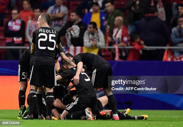 Qarabag players celebrate the opening goal during the UEFA Champions League football match Club Atletico de Madrid vs Qarabag FK at the Wanda...