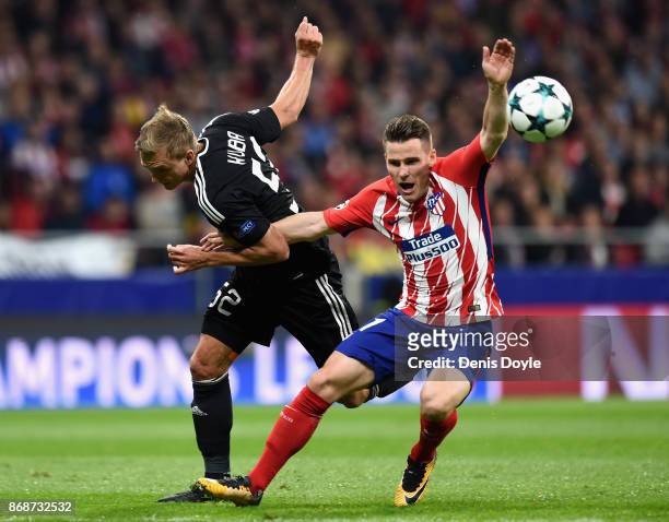 Jakub Rzezniczak of Qarabag FK and Kevin Gameiro of Atletico Madrid in action during the UEFA Champions League group C match between Atletico Madrid...