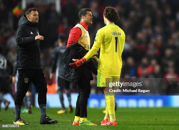 Julio Cesar consoles Mile Svilar of Benfica following his own goal during the UEFA Champions League group A match between Manchester United and SL...