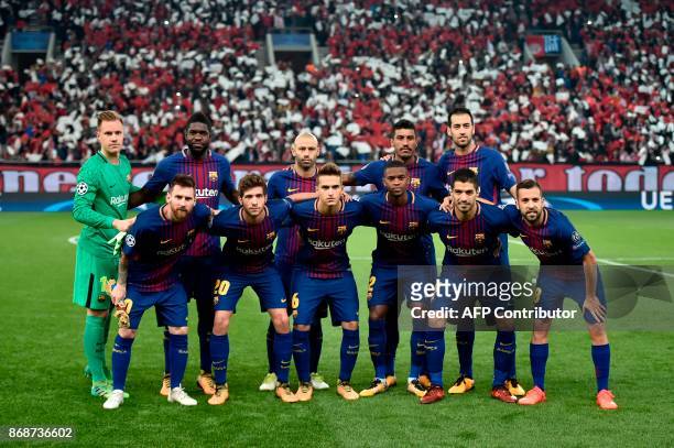 Barcelona team Barcelona's Argentinian forward Lionel Messi, Barcelona's Spanish midfielder Sergi Roberto, Barcelona's Spanish midfielder Denis...
