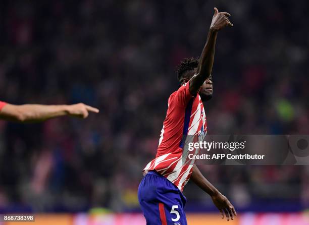 Atletico Madrid's Ghanaian midfielder Thomas celebrates a goal during the UEFA Champions League football match Club Atletico de Madrid vs Qarabag FK...