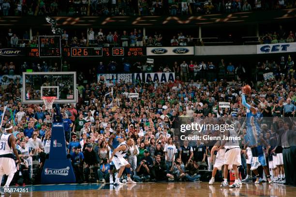 Carmelo Anthony of the Denver Nuggets shoots what would be the game winning three against the Dallas Mavericks in Game Three of the Western...