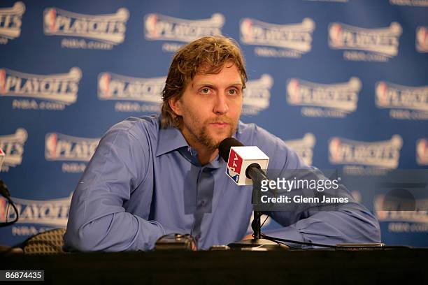 Dirk Nowitzki of the Dallas Mavericks speaks with members of the media after a loss against the Denver Nuggets in Game Three of the Western...