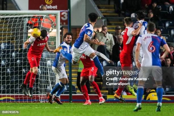 Fleetwood Town's Bobby Grant heads clear a header from Blackburn Rovers' Derrick Williams during the Sky Bet League One match between Blackburn...