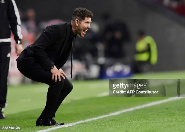 Atletico Madrid's Argentinian coach Diego Simeone shouts instructions to players during the UEFA Champions League football match Club Atletico de...