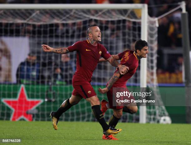 Diego Perotti with his teammate Radja Nainggolan of AS Roma celebrates after scoring the team's third goal during the UEFA Champions League group C...