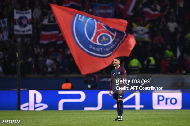 Paris Saint-Germain's French defender Layvin Kurzawa reacts after a third goal during the UEFA Champions League Group B football match between Paris...