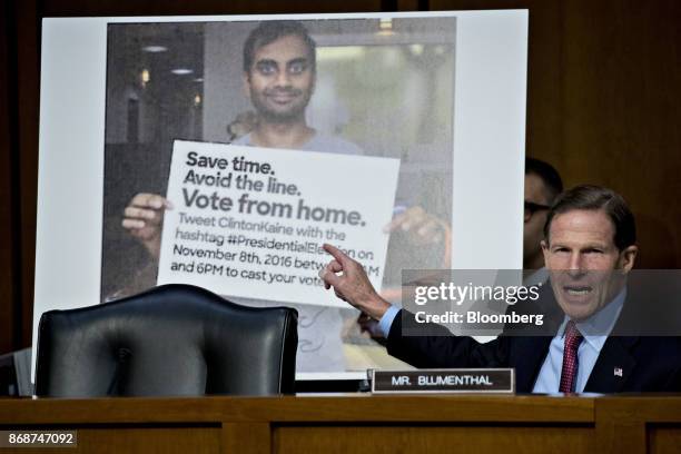 Senator Richard Blumenthal, a Democrat from Connecticut, questions witnesses in front of a photograph used on Twitter Inc. During a Senate Judiciary...