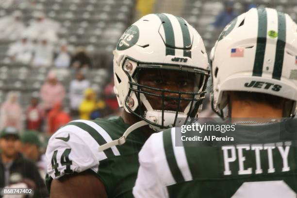 Fullback Lawrence Thomas of the New York Jets in action against the Atlanta Falcons in a heavy rain storm during their game at MetLife Stadium on...