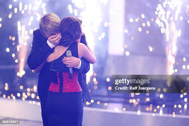 Daniel Schuhmacher hugs Sarah Kreuz as he wins the singer qualifying contest DSDS 'Deutschland sucht den Superstar' on May 02, 2009 in Cologne,...