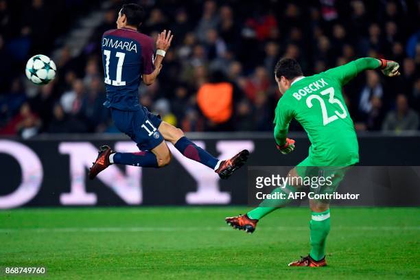 Anderlecht's Belgian goalkeeper Frank Boeckx kicks the ball past Paris Saint-Germain's Argentinian forward Angel Di Maria during the UEFA Champions...