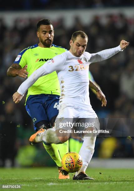 Pierre-Michel Lasogga of Leeds United takes a shot at goal under pressure from Tom Huddlestone of Derby Countyduring the Sky Bet Championship match...