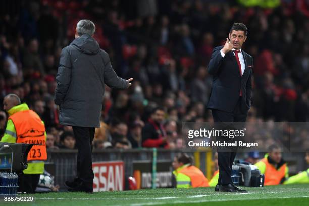 Rui Vitoria of Benfica speaks with Jose Mourinho, Manager of Manchester United during the UEFA Champions League group A match between Manchester...