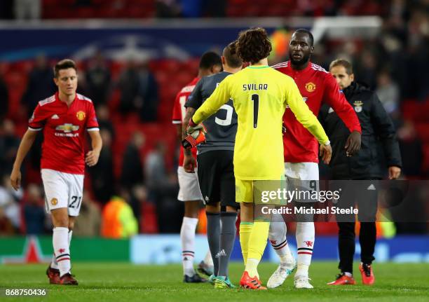 Mile Svilar of Benfica and Romelu Lukaku of Manchester United speak following the UEFA Champions League group A match between Manchester United and...