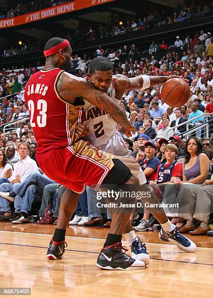 Joe Johnson of the Atlanta Hawks drives against LeBron James of the Cleveland Cavaliers in Game Three of the Eastern Conference Semifinals during the...