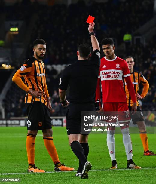 Hull City's Michael Hector is shown a red card by referee Tim Robinson during the Sky Bet Championship match between Hull City and Middlesbrough at...