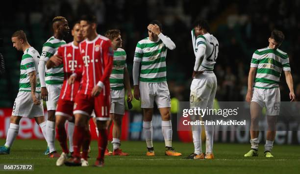 Dedryck Boyata, Tomas Rogic and Kieran Tierney of Celtic of Celtic react at full time during the UEFA Champions League group B match between Celtic...