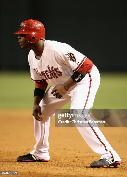 Justin Upton of the Arizona Diamondbacks leads off first base against the Washington Nationals during the game at Chase Field on May 8, 2009 in...