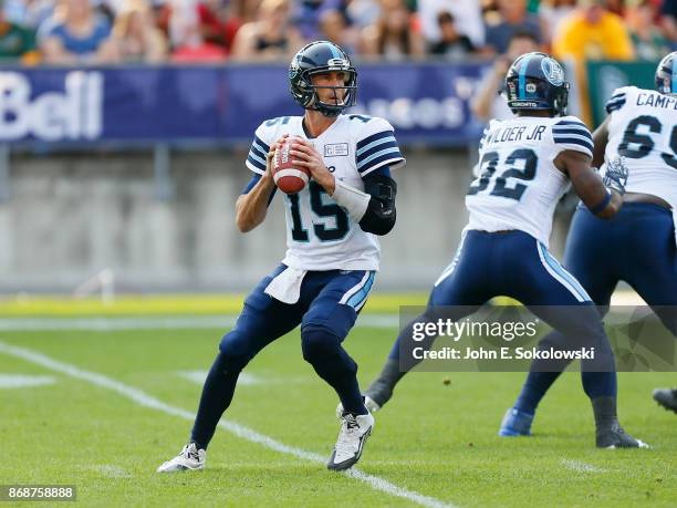 Ricky Ray of the Toronto sets up to pass behind the blocking of James Wilder Jr. #32 of the Toronto Argonauts against the Edmonton Eskimos during a...
