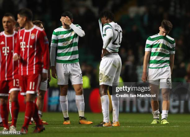Dedryck Boyata, Tomas Rogic and Kieran Tierney of Celtic of Celtic react at full time during the UEFA Champions League group B match between Celtic...